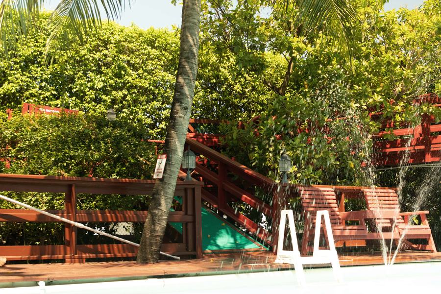 Paradise pool and two-level wooden deck in the garden